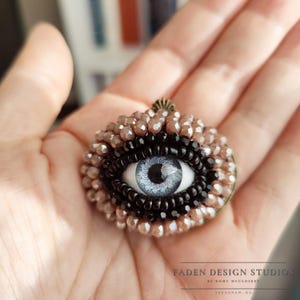 Petite Evil Eye Brooch – light blue eye with rose glass beads