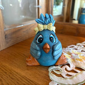 Hand painted, ceramic Henny Penny chick.