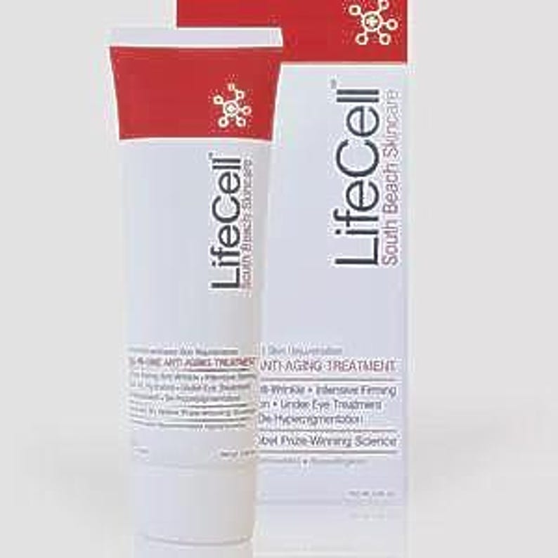 K&ouml;nnte beinhalten: Eine wei&szlig;e Tube und eine passende rechteckige Schachtel der LifeCell South Beach Skincare Anti-Aging-Behandlung. Die Verpackung hat rote Akzente am oberen Rand, den Markennamen in schwarzer Schrift und listet Vorteile wie Straffung und Feuchtigkeit.