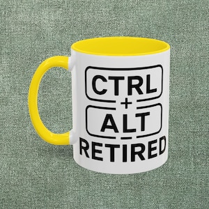 May include: White ceramic mug with a yellow interior and handle. The mug features the text "CTRL + ALT RETIRED" in black, a humorous nod to computer shortcuts and retirement.