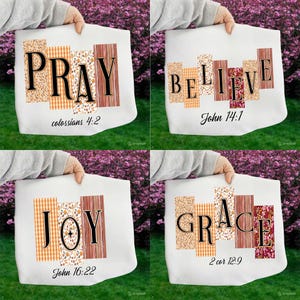 May include: Four white tote bags, each with a different word: PRAY, BELIEVE, JOY, and GRACE. Each word is in black, with decorative rectangular panels behind them. The bags also have Bible verses.