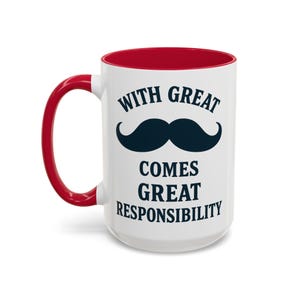 May include: White ceramic mug with a red interior and handle. The mug features a black mustache graphic and the text "WITH GREAT COMES GREAT RESPONSIBILITY" in a bold, sans-serif font. A humorous gift idea.