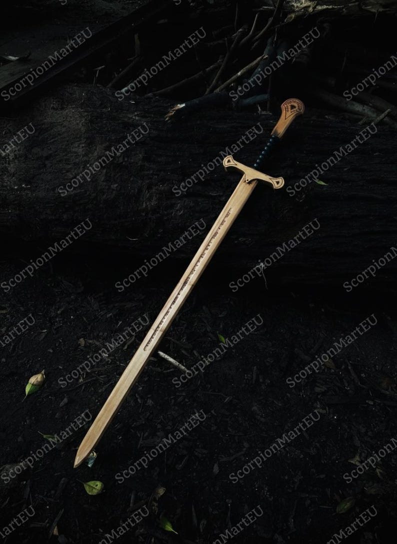 May include: A wooden sword with a crossguard and a detailed handle. The blade has a carved design along its length. The sword is set against a dark, natural background, suggesting an outdoor setting. The overall aesthetic is reminiscent of fantasy weaponry.