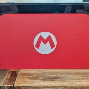 Mario Emblem Switch 2 Dock Cover Faceplate