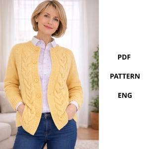 May include: A yellow cable-knit cardigan with a round neckline and button closure. The cardigan is worn over a white collared shirt and blue jeans. The text "PDF PATTERN ENG" is visible on the right side of the image.