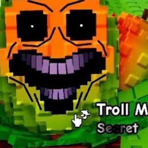 May include: A pixelated character with an orange face, black eyes, and a purple-toothed grin. The character is surrounded by green and yellow blocks. The text "Troll M Secret" is visible.