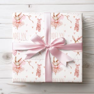 Personalized ballerina bunny wrapping paper with pink bow, custom name printed, perfect for girls birthday gifts.