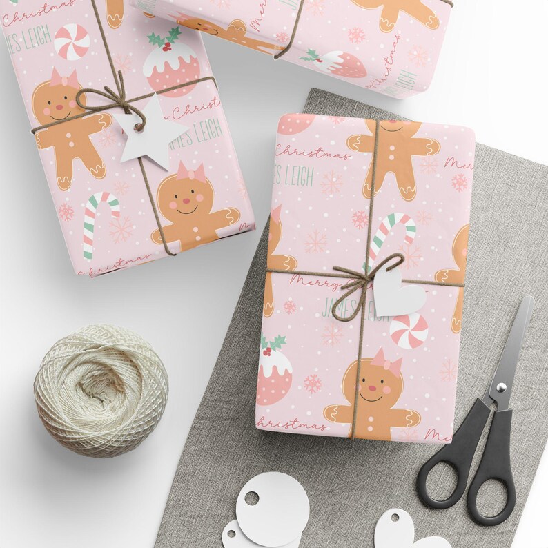 Custom name Christmas gift wrap featuring gingerbread girl, candy canes, and pink snowflakes