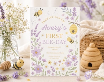 May include: A rectangular invitation card featuring a bee-themed design with lavender flowers, daisies, and two cartoon bees. The text reads: buzz on over for Avery's FIRST BEE-DAY, Saturday, June 15, 2:00 PM, 1234 Honeycomb Lane, RSVP to Janna at (123) 456-7890.