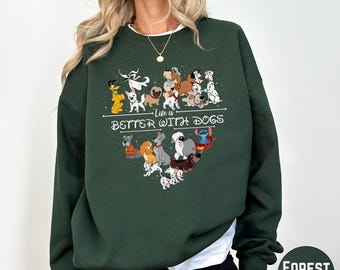 May include: Forest green sweatshirt with a heart-shaped graphic of cartoon dogs and the text "Life is Better With Dogs." The sweatshirt is a solid color and has a crew neck.