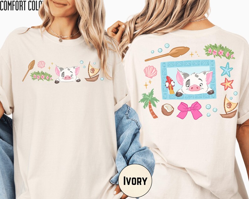 two white t-shirts with colorful and whimsical designs, including a pig, palm tree, starfish, and other tropical elements. The t-shirts are displayed on a person's back, showcasing the vibrant and playful artwork.