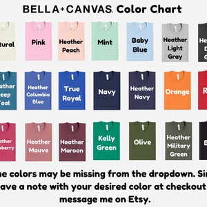 The image is a color chart displaying various t-shirt colors, including natural, pink, heather, mint, baby blue, heather light, gray, heather dark, red, navy, orange, kelly green, olive, black, and military green. Some colors may be missing from the dropdown, so it is recommended to leave a note with your desired color at checkout or message the seller on Etsy.