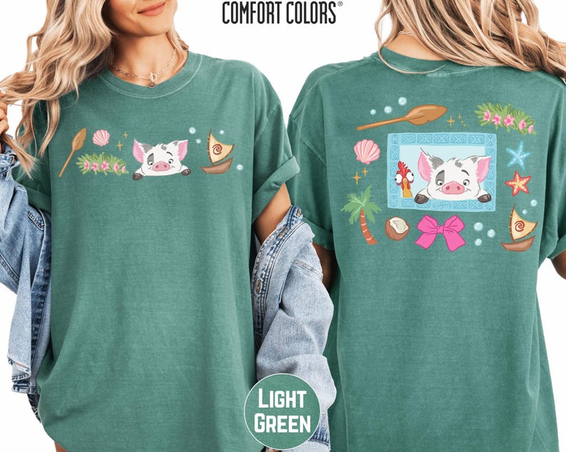 two green t-shirts with colorful cartoon pig designs and various other decorative elements.