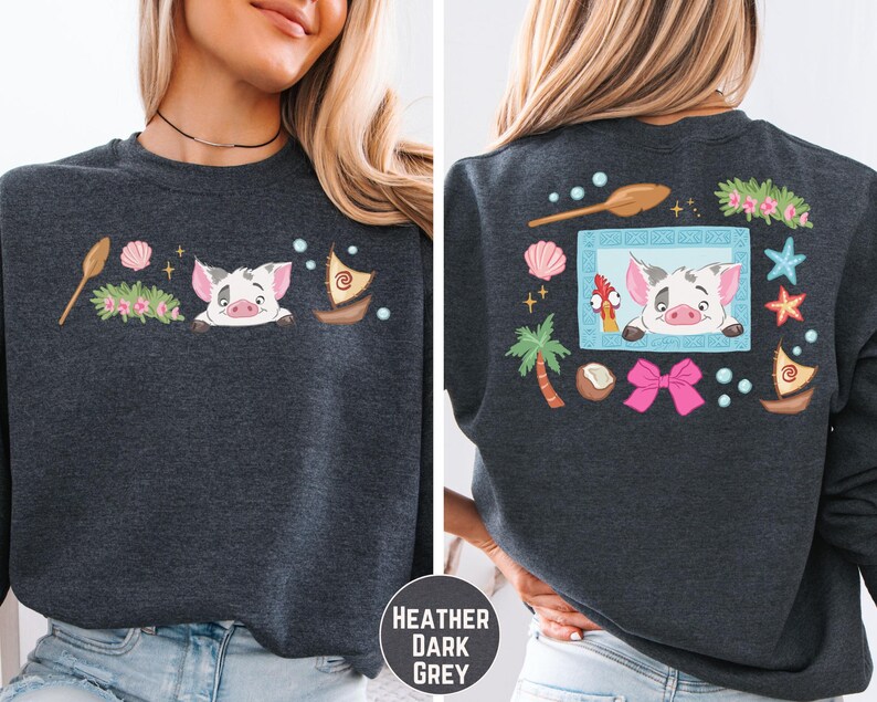 a woman wearing a gray sweatshirt with a cartoon pig design on the front and back.