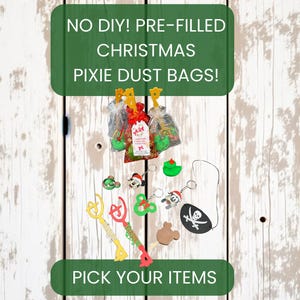 May include: Pre-filled Christmas pixie dust bags and assorted party favors including plastic wands, character keychains, a green rubber duck, a brown mouse-shaped charm, and a black pirate eye patch with a white skull and crossbones design.