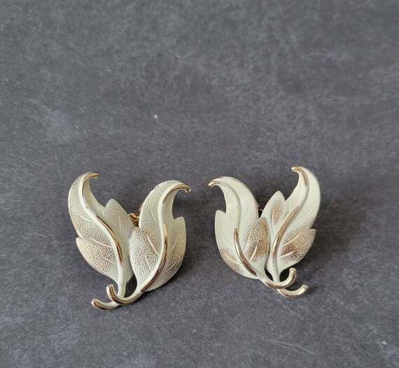 Monet White Leaf Earrings Clip On Gold Tone - image 1