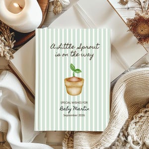Op de afbeelding: Een geboortekaartje met een lichtgroene en witte streepjesachtergrond. De kaart bevat de tekst "A little sprout is on the way" en een illustratie van een spruit in een pot. De kaart is gepersonaliseerd met de naam "Baby Martin" en de datum "September 2026".