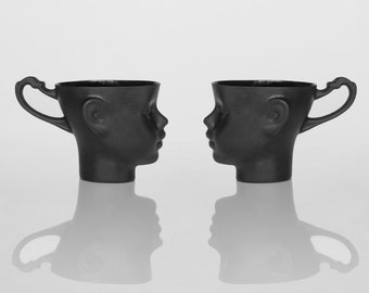 DOLL HEAD Set of two black porcelain mugs