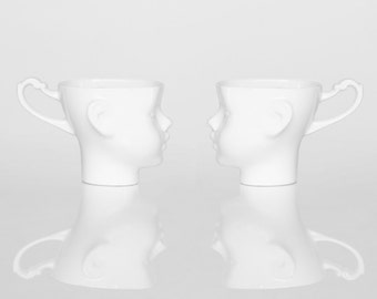 DOLL HEAD Set of two white porcelain mugs