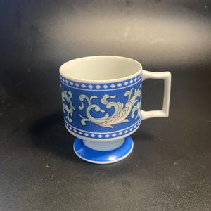 vintage Florencia model 743 pedestal stacking mug from the 1960s, featuring a blue and white paisley pattern
