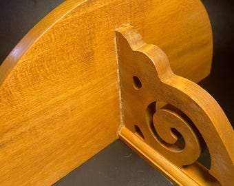 Wooden shelf with scrollwork Corbel