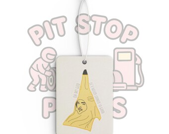 May include: Rectangular air freshener with a string for hanging. The design features a yellow figure with a face and the text "OH MY GOD" and "I'VE NEVER LOOKED SO GOOD". The background is white.