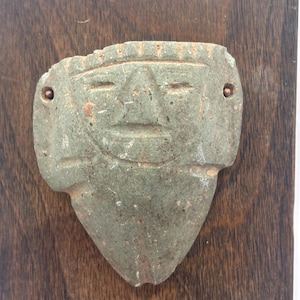 Carved Stone Figure Artifact on Wooden Stand