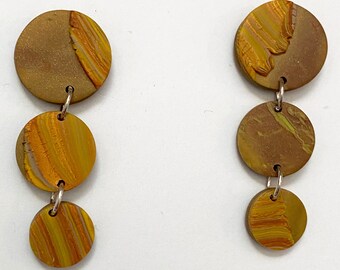 Polymer clay earrings; three tiered, layered and marbled clay, joined with sterling silver rings.
