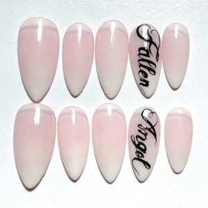 May include: A set of three ceramic mugs with a speckled, matte finish. The mugs are in shades of cream, light gray, and dark gray. Each mug has a simple, minimalist design and a rounded handle.