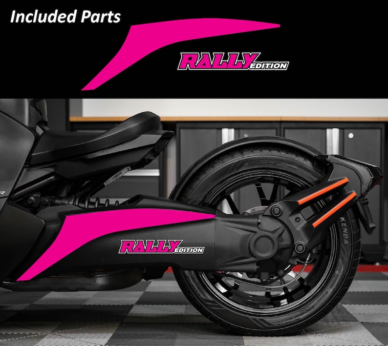 May include: A black Can-Am Ryker with hot pink "Rally Edition" decals. The decals are on the side panel and include the text "Rally Edition". The image also shows the rear tire and suspension.