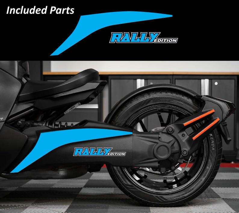 May include: A black and blue motorcycle with the text "RALLY EDITION" in white and blue. The image shows included parts with a blue design. The motorcycle has a black tire and orange accents.