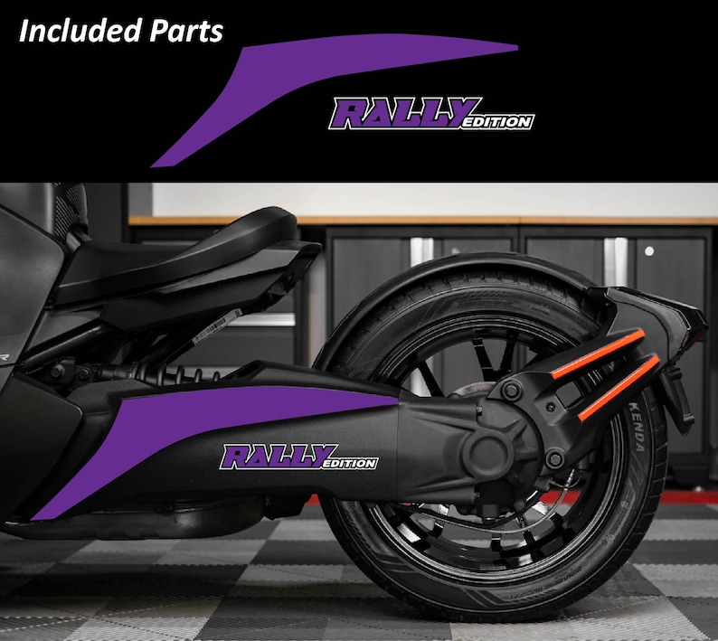 May include: Purple "Rally Edition" decals for a motorcycle. The decals are shown on the side of the vehicle, with the text in white and purple. The image also shows the rear wheel and other parts of the motorcycle.
