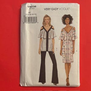 May include: A sewing pattern for a dress and top with cold shoulder details. The pattern is for sizes 6-8-10-12-14 and is from Very Easy Vogue.