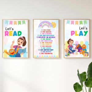 May include: Three framed art prints with educational themes. The prints feature colourful illustrations of children and friendly characters, with phrases like "Let's READ" and "Let's PLAY." One print lists positive affirmations.