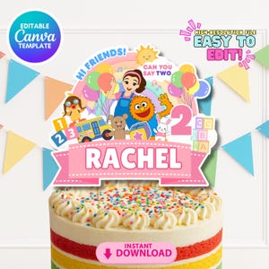 May include: A colorful birthday cake with a decorative topper featuring cartoon characters, balloons, and the name "Rachel." The topper includes the text "Hi Friends!" and "Can You Say Two." The cake is decorated with rainbow layers and topped with white frosting and sprinkles.