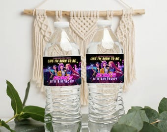 May include: Two clear plastic water bottles with labels. The labels feature a colorful graphic of animated characters and the text "LIKE I'M BORN TO BE" and "Rumi's 8th Birthday". The bottles are displayed against a white background.