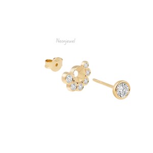 May include: Gold-colored stud earrings with clear, round gemstones. One earring features a single gemstone, while the other has a cluster of gemstones. The earring backs are also gold. The brand name "Neonjewel" is printed on the image.