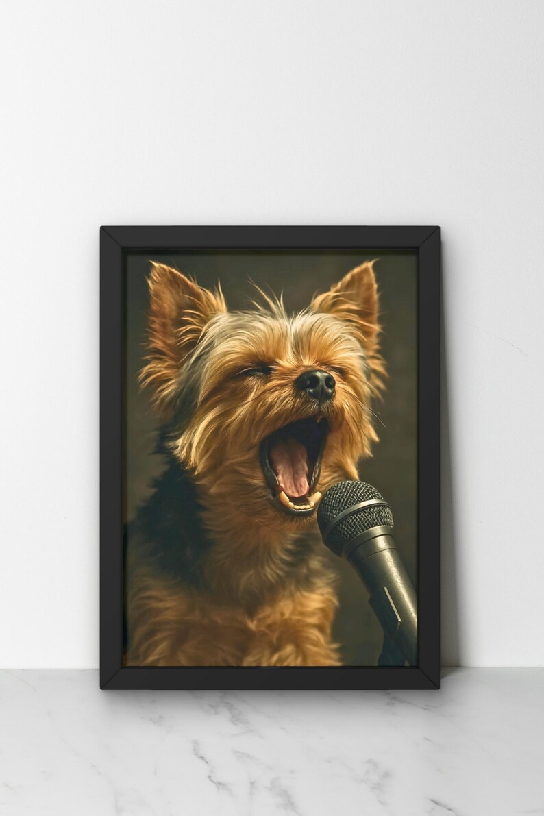 May include: Framed print featuring a Yorkshire Terrier with its mouth wide open, as if singing into a microphone. The dog has brown and black fur. The microphone is black. The frame is black and the background is a dark green.