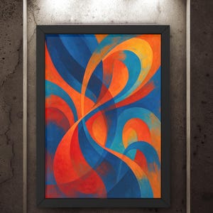 May include: Abstract art print in a black frame. The artwork features flowing, overlapping shapes in shades of blue, orange, and red. The painting is displayed on a textured, gray wall, illuminated by three overhead spotlights.