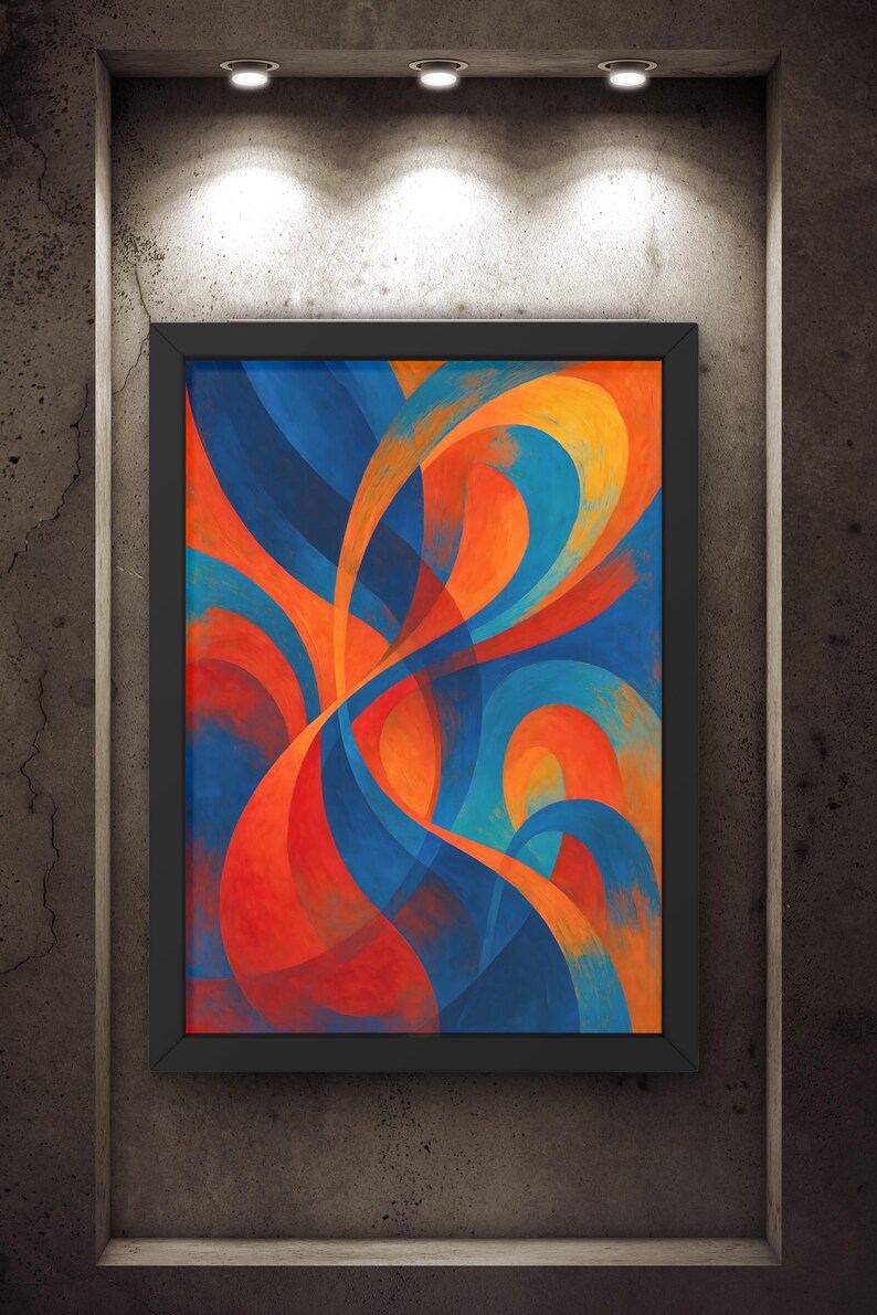 May include: Abstract art print in a black frame. The artwork features flowing, overlapping shapes in shades of blue, orange, and red. The painting is displayed on a textured, gray wall, illuminated by three overhead spotlights.