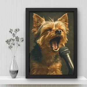 May include: A framed print featuring a Yorkshire Terrier with its mouth wide open, as if singing into a microphone. The dog has brown and black fur. The microphone is black. The frame is black, and the background is a dark color.