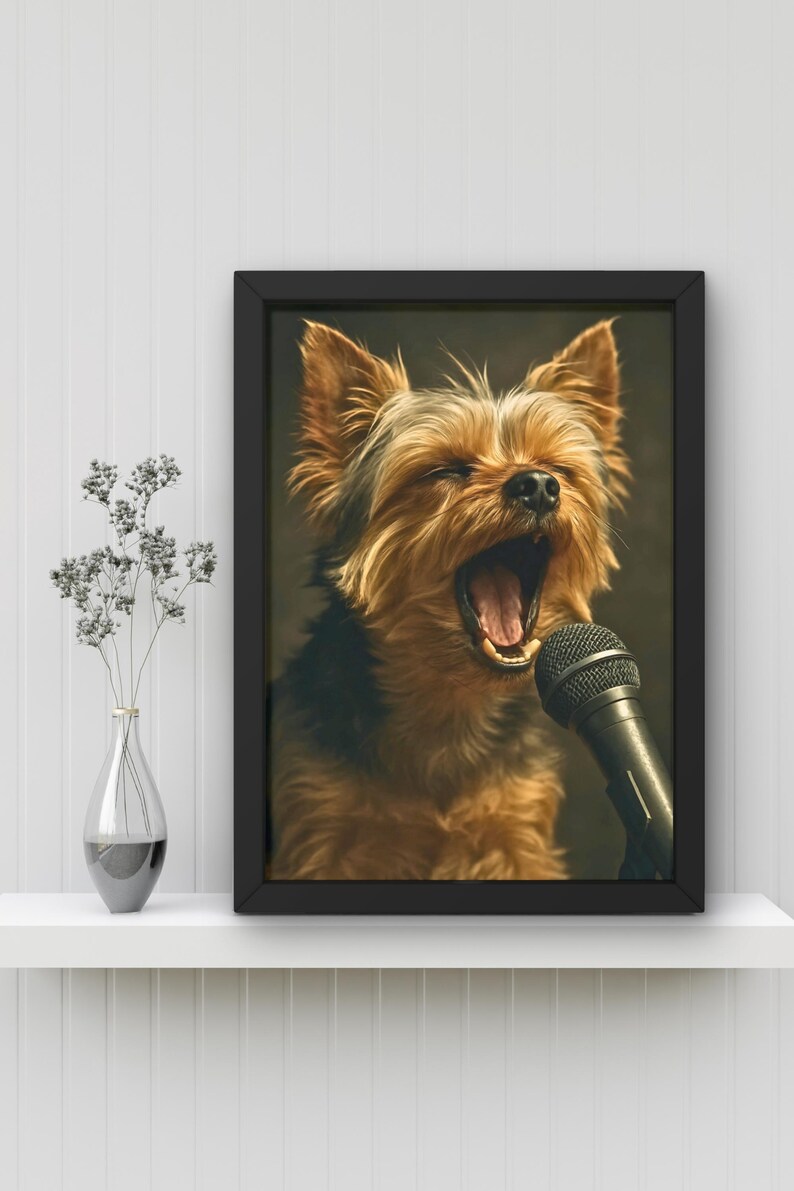 May include: A framed print featuring a Yorkshire Terrier with its mouth wide open, as if singing into a microphone. The dog has brown and black fur. The microphone is black. The frame is black, and the background is a dark color.