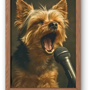 May include: A framed print featuring a Yorkshire Terrier with its mouth open, as if singing into a microphone. The dog has brown and black fur and is positioned in front of a dark background. The frame is made of wood.