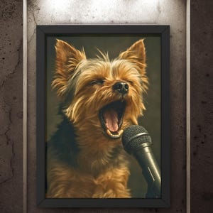 May include: Framed artwork featuring a Yorkshire Terrier with its mouth wide open, as if singing into a microphone. The dog has brown and black fur, and the microphone is black. The artwork is displayed on a textured gray wall.