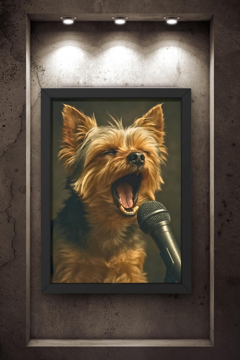 May include: Framed artwork featuring a Yorkshire Terrier with its mouth wide open, as if singing into a microphone. The dog has brown and black fur, and the microphone is black. The artwork is displayed on a textured gray wall.