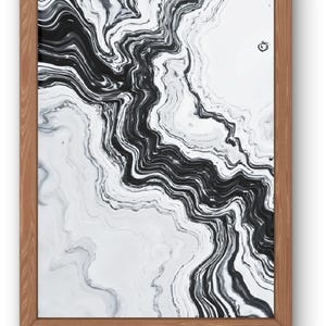 May include: Abstract art print in a wooden frame. The artwork features a black and white marbled design with flowing, wavy lines. The frame is a light brown color, providing a natural contrast to the artwork.