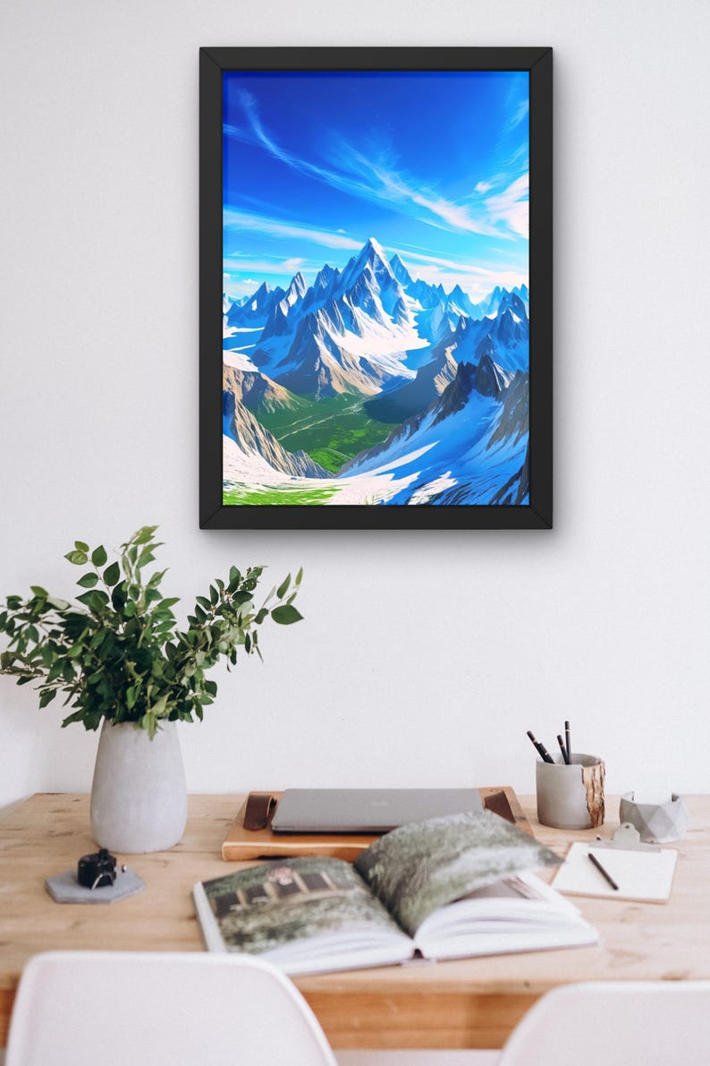 May include: Framed art print featuring a vibrant mountain landscape. The artwork depicts snow-capped peaks under a bright blue sky with wispy clouds. The scene includes green valleys and a sense of depth, creating a serene and majestic view.