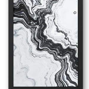 May include: Abstract black and white art print in a black frame. The artwork features a flowing, marbled design with swirling patterns of black and gray against a white background. The frame is rectangular.