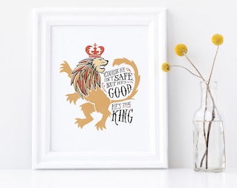 May include: A white framed print with a stylized illustration of a lion wearing a crown. The lion is gold with red and white accents. The text reads "Course he isn't safe, but he's good. He's the King."