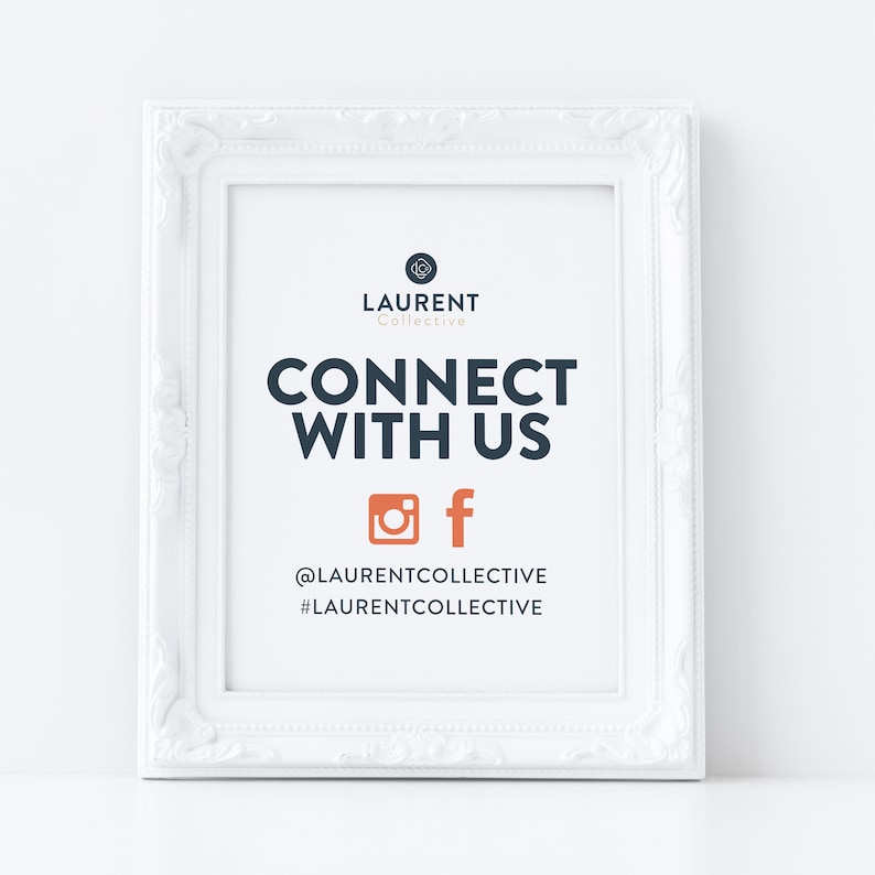 May include: White framed sign with the text "LAURENT Collective CONNECT WITH US" and social media icons for Instagram and Facebook. The text below the icons reads "@LAURENTCOLLECTIVE #LAURENTCOLLECTIVE".